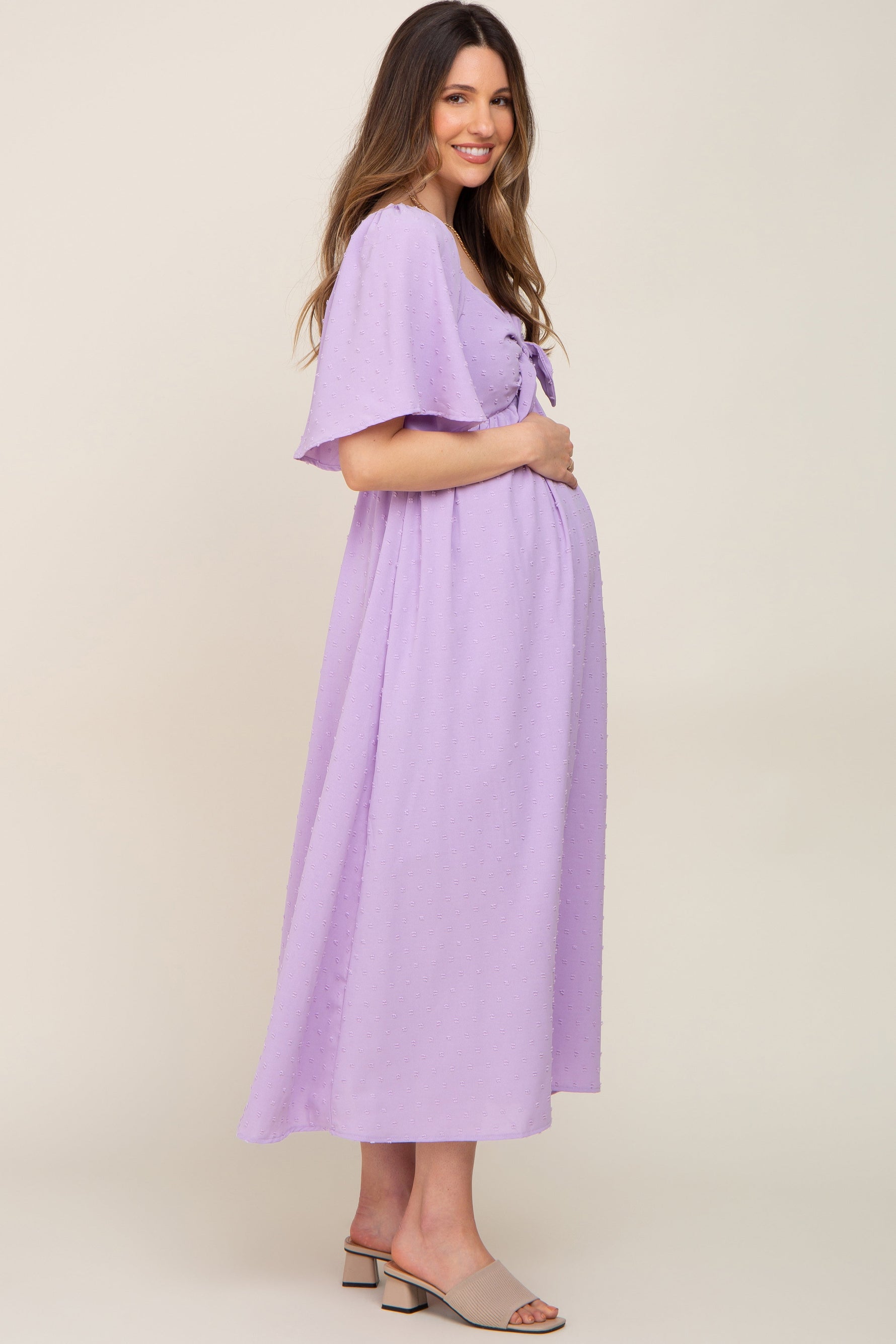 PinkBlush Lavender Textured Dot Front Tie Ruffle Sleeve Maternity Midi Dress on a model.