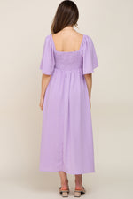 PinkBlush Lavender Textured Dot Front Tie Ruffle Sleeve Maternity Midi Dress on a model.