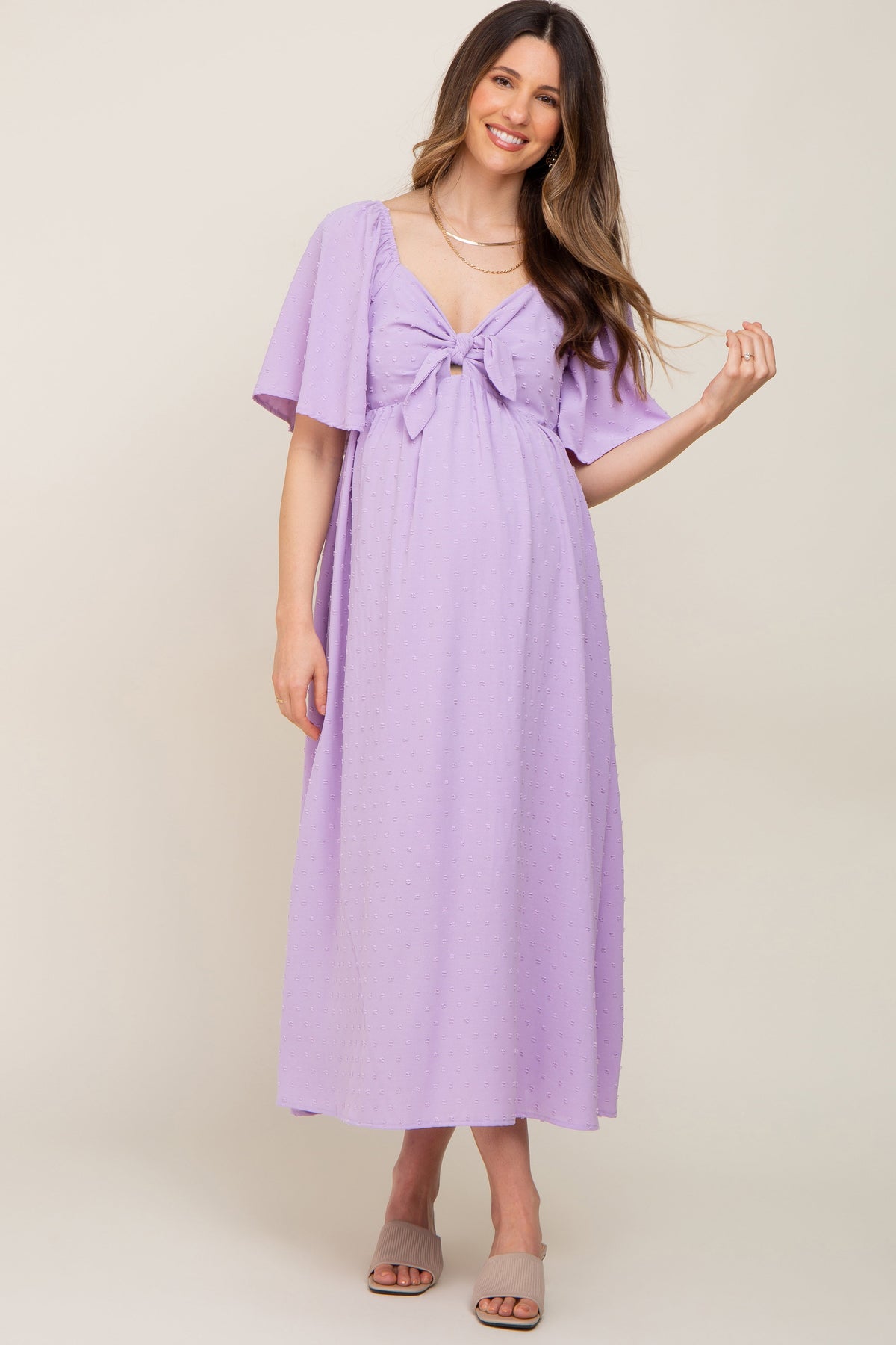 PinkBlush Lavender Textured Dot Front Tie Ruffle Sleeve Maternity Midi Dress on a model.