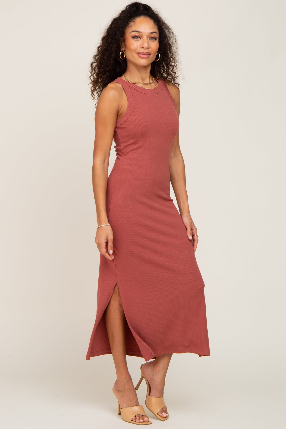Model wearing a comfortable rust ribbed tank dress with a stylish side slit, perfect for everyday wear.