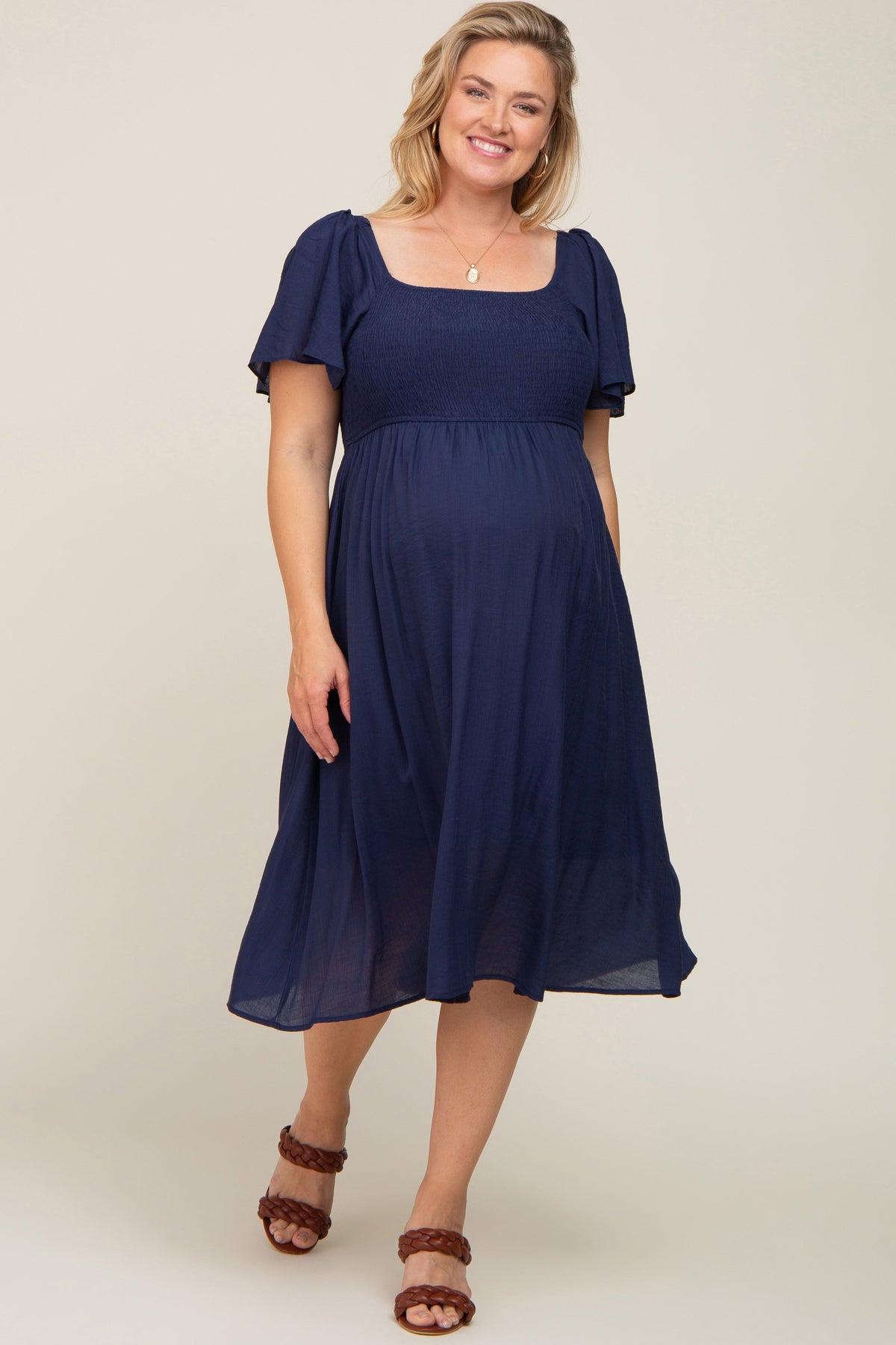 Navy Blue Smocked Square Neck Flutter Short Sleeve Maternity Plus Midi Dress by PinkBlush (view 1 of 5)