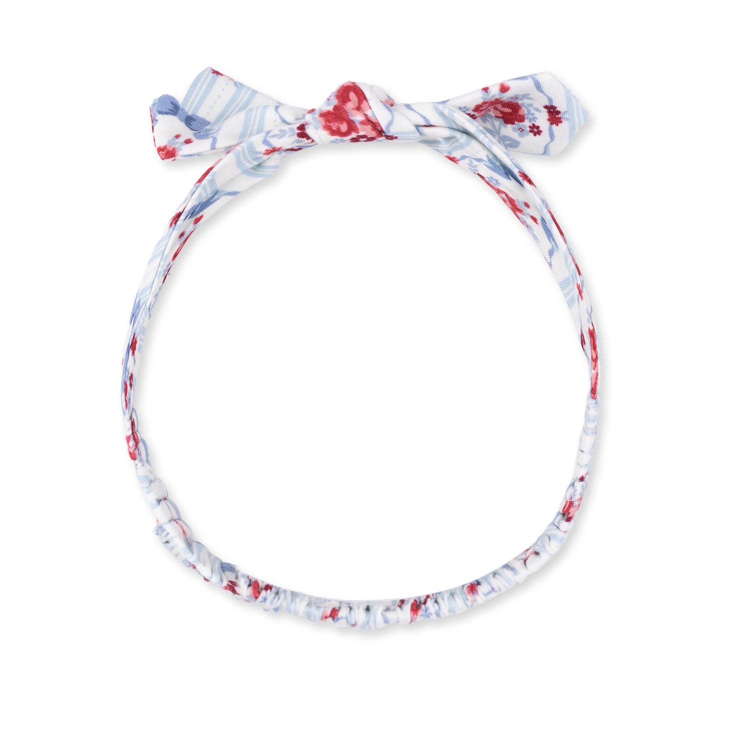 Knot headband in a cameo stripe print with a knotted bow detail at the front