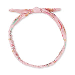 Pink baby knot headband with a vintage reindeer and Santa print