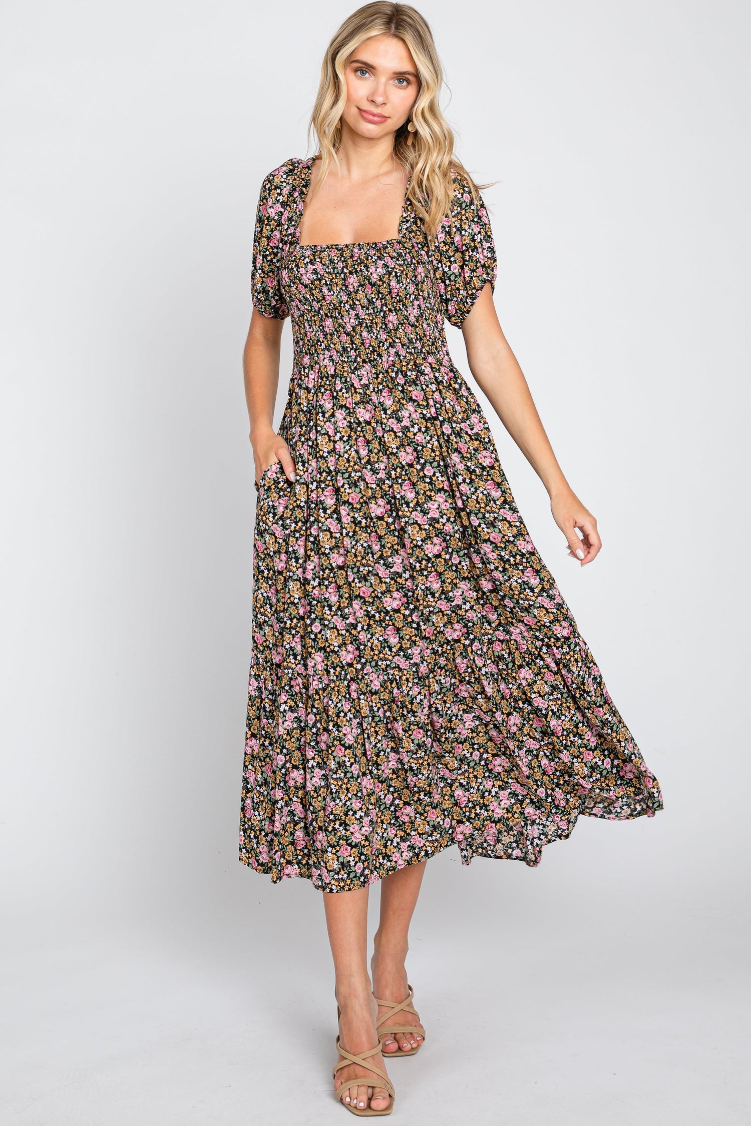 Pink floral midi dress with a smocked bodice and puff sleeves