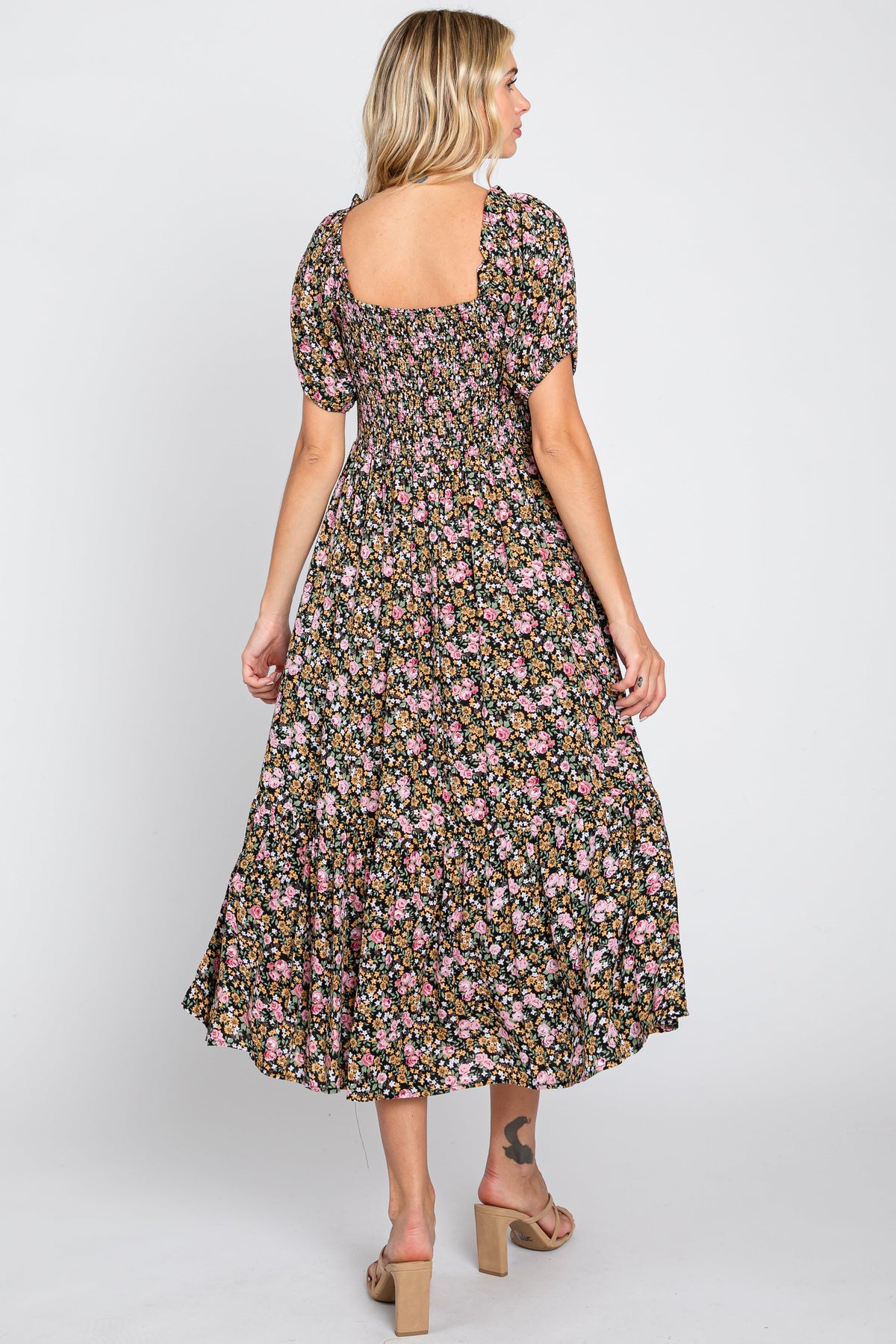 Organic pink floral smocked puff sleeve baby midi dress.