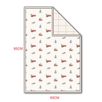 Quilted bamboo blanket with a red truck holiday print on the smooth front and a coordinating solid quilted back.