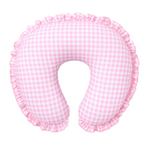 Soft pink gingham ruffle nursing pillow cover by Little Mae & Co, styled in a cozy baby nursery.