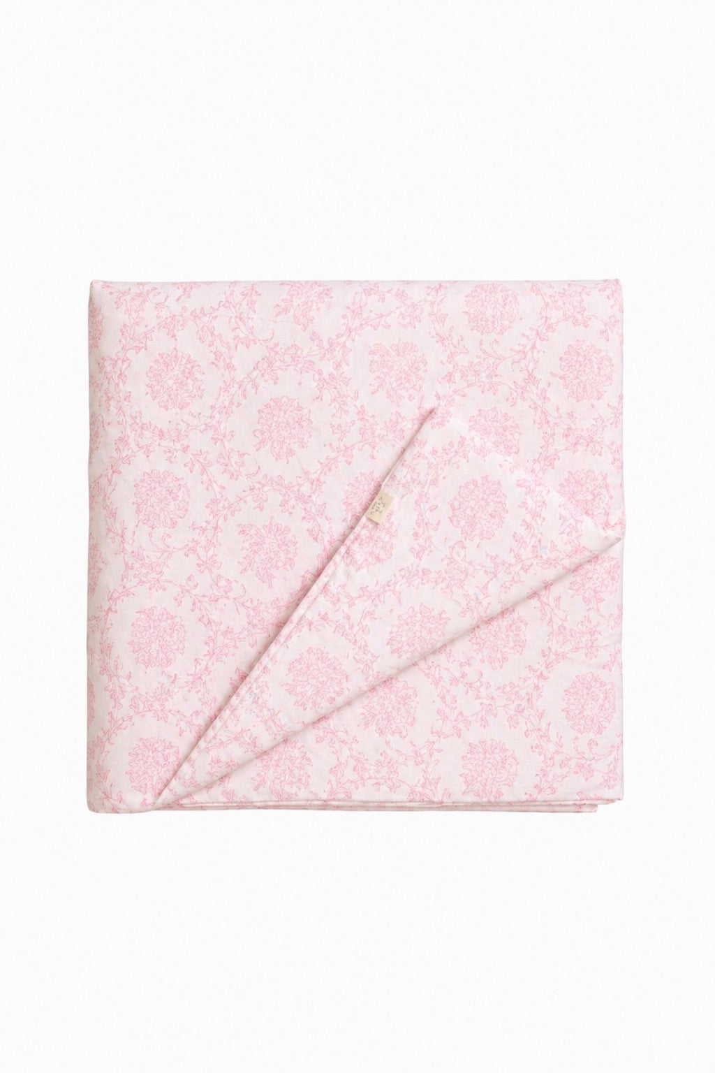 Pink chinoiserie-print quilted crib blanket, hand-tufted with a fluffy quilted texture.