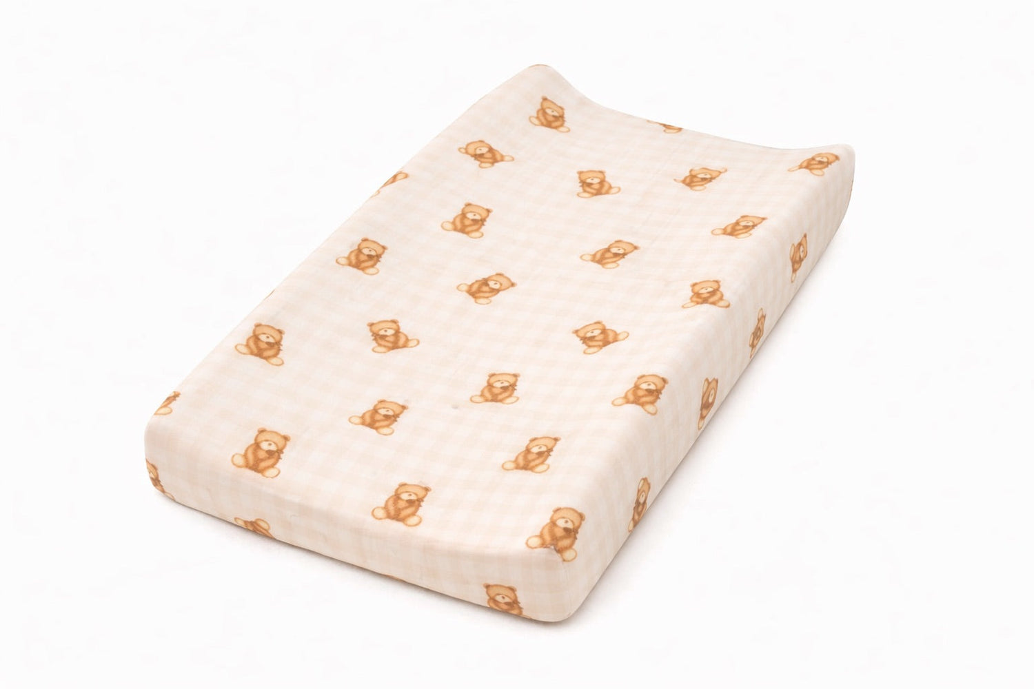 Beige and white teddy gingham changing pad cover with elastic edges on a changing pad.