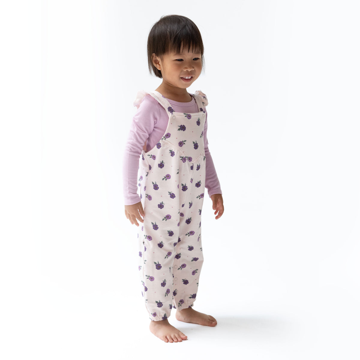 Baby two-piece set with Violetta floral ruffle V-overalls, adjustable straps, elastic cuffs, and long sleeve bodysuit