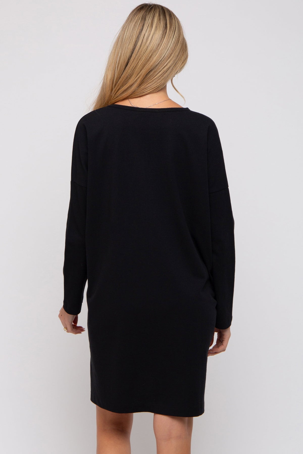PinkBlush black long sleeve maternity shirt dress on a pregnant model, showcasing comfort & style.