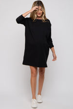 PinkBlush black long sleeve maternity shirt dress on a pregnant model, showcasing comfort & style.