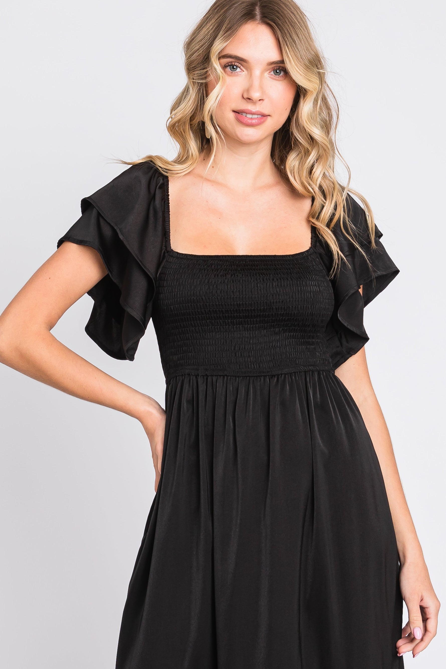 PinkBlush black satin flutter sleeve midi dress. Chic maternity wear.
