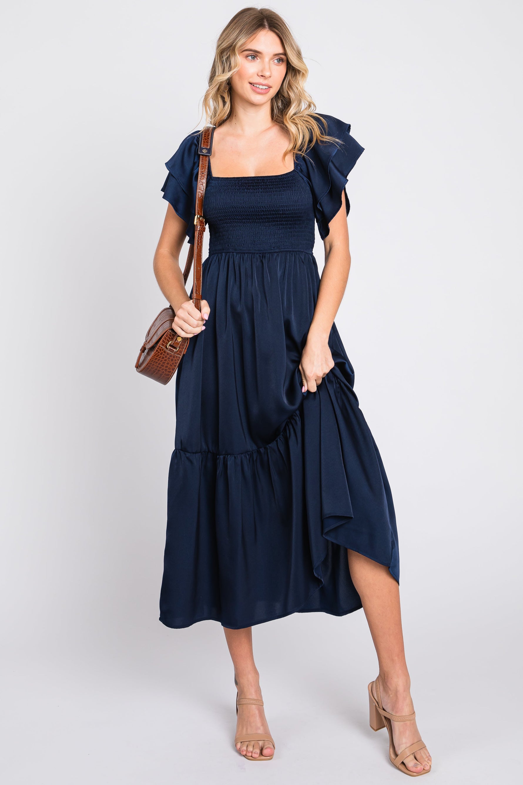 Navy satin midi dress with flutter sleeves, square neckline, smocked top and ruffle hem
