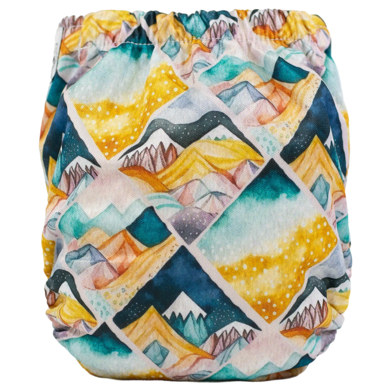 Tiny Tushies Newborn AIO Cloth Diaper with colorful geometric print.