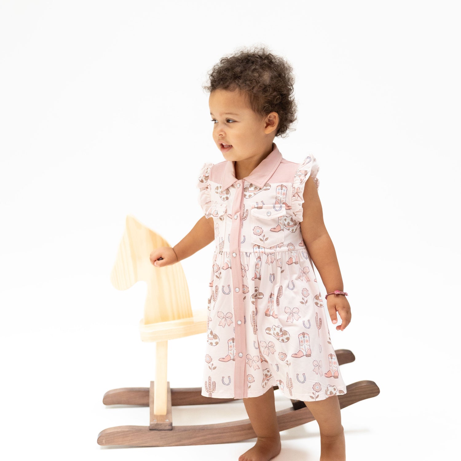 Western pearl snap dress with cowgirl boots and bows print, paired with a matching bloomer.