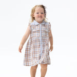 Western plaid baby dress with pearl snaps and rose embroidery on the back, shown with matching bloomer diaper cover
