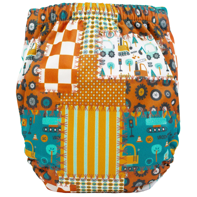 Tiny Tushies Newborn AIO Cloth Diaper with colorful pattern design.