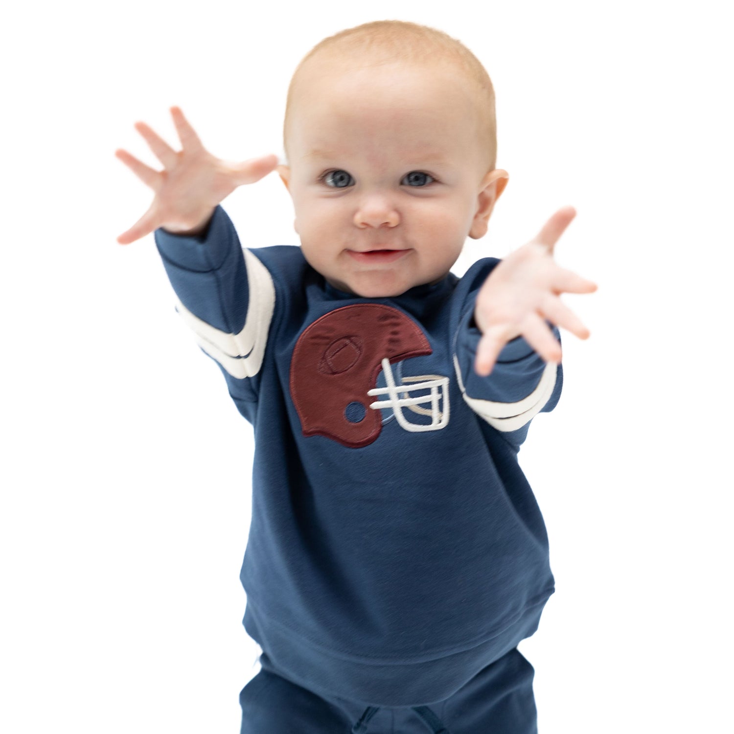 Drop sleeve sweatshirt with varsity stripes and a maroon football helmet applique on the front