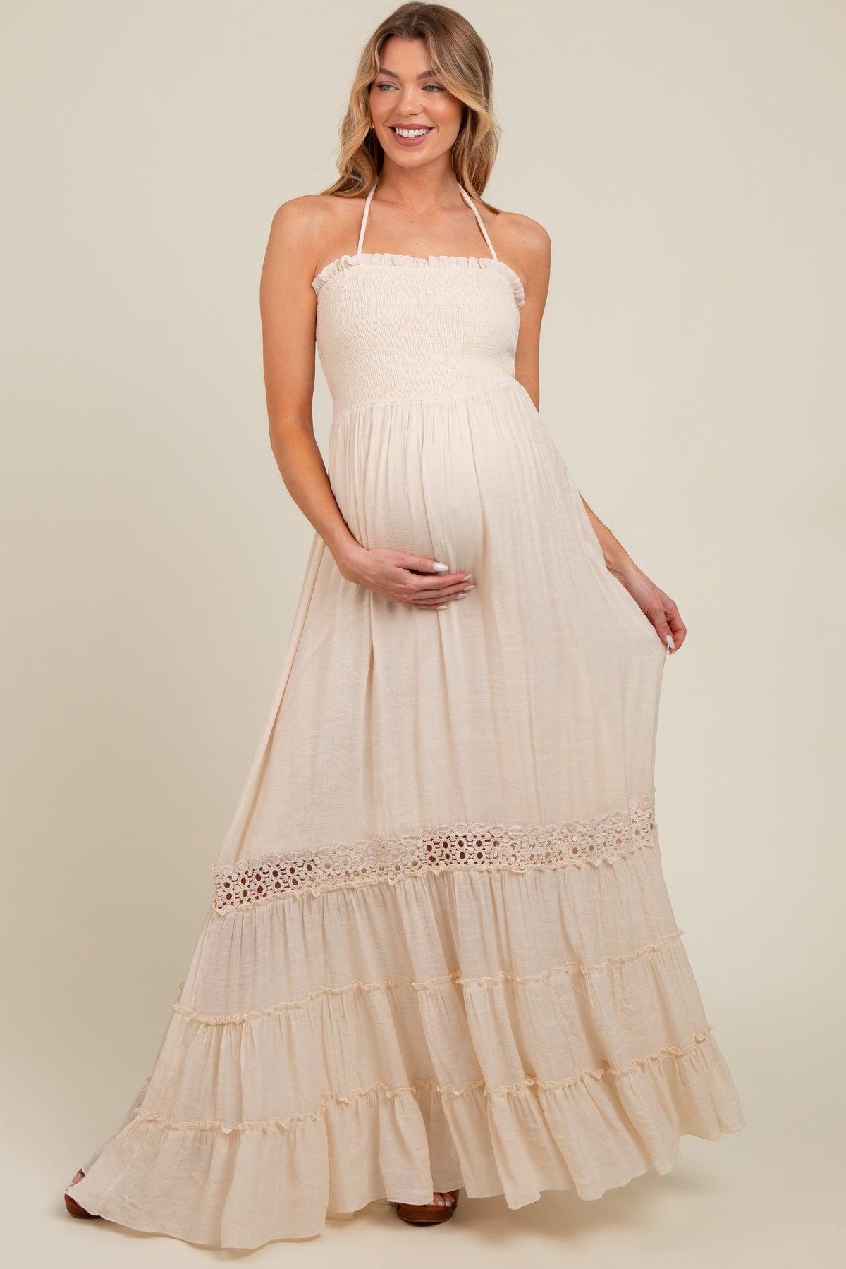 Smocked open back maternity maxi dress with adjustable straps and flowing skirt