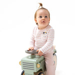 Pink long sleeve baby shirt with cow pocket applique and a sunflower tucked behind the cow's ear