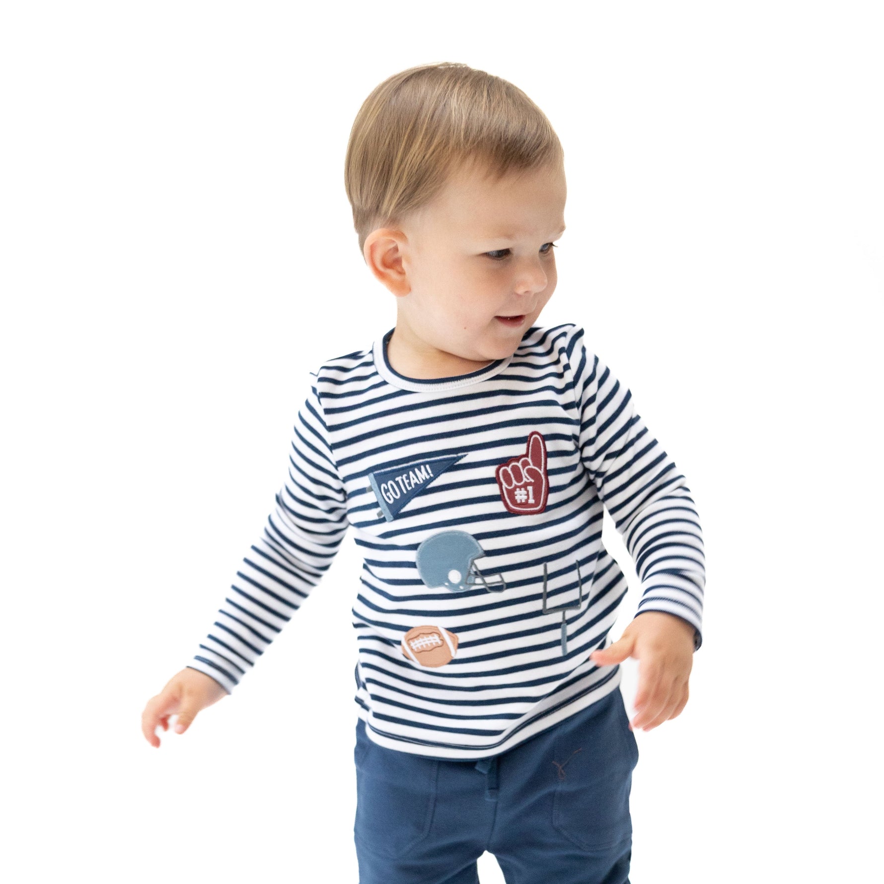 Navy long sleeve baby shirt with football appliques including helmets, footballs and foam fingers