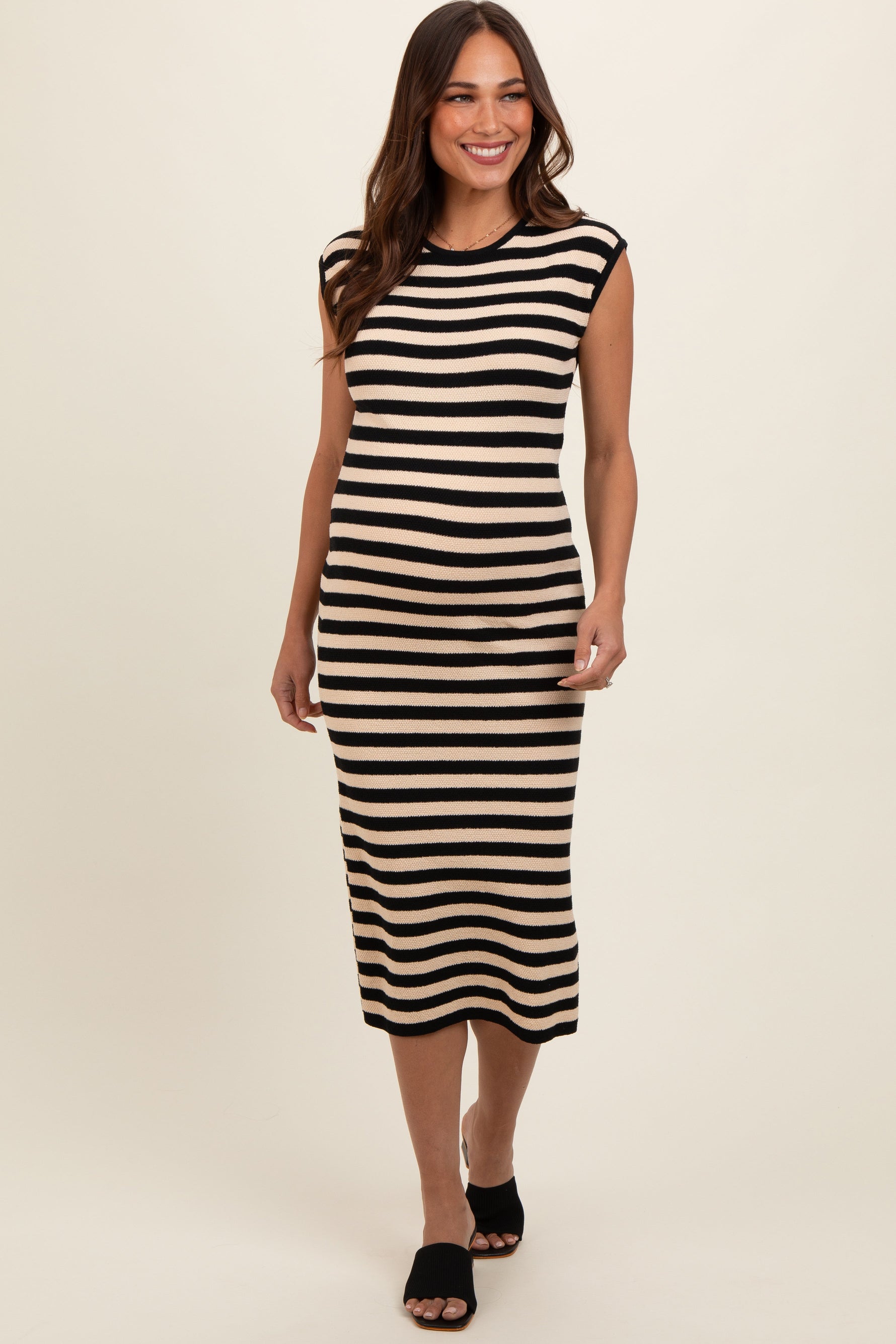 Black and white striped sleeveless maternity midi dress with a rounded neckline