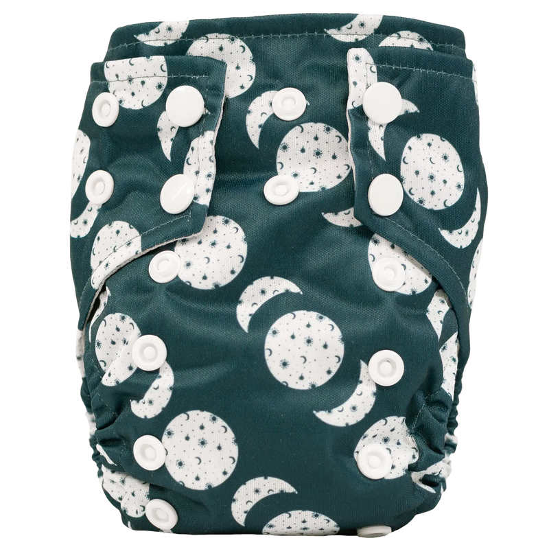 Tiny Tushies Newborn AIO Cloth Diaper with snaps and moon pattern design.