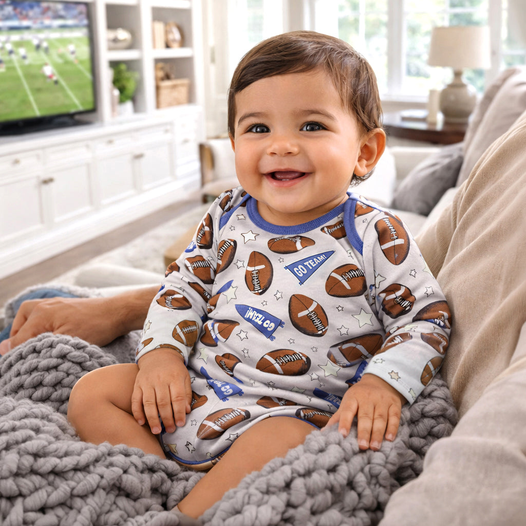 Baby bodysuit with a football-themed print and bottom snap closures