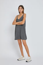 Baby wearing a soft organic charcoal ribbed sleeveless dress with a front seam detail.