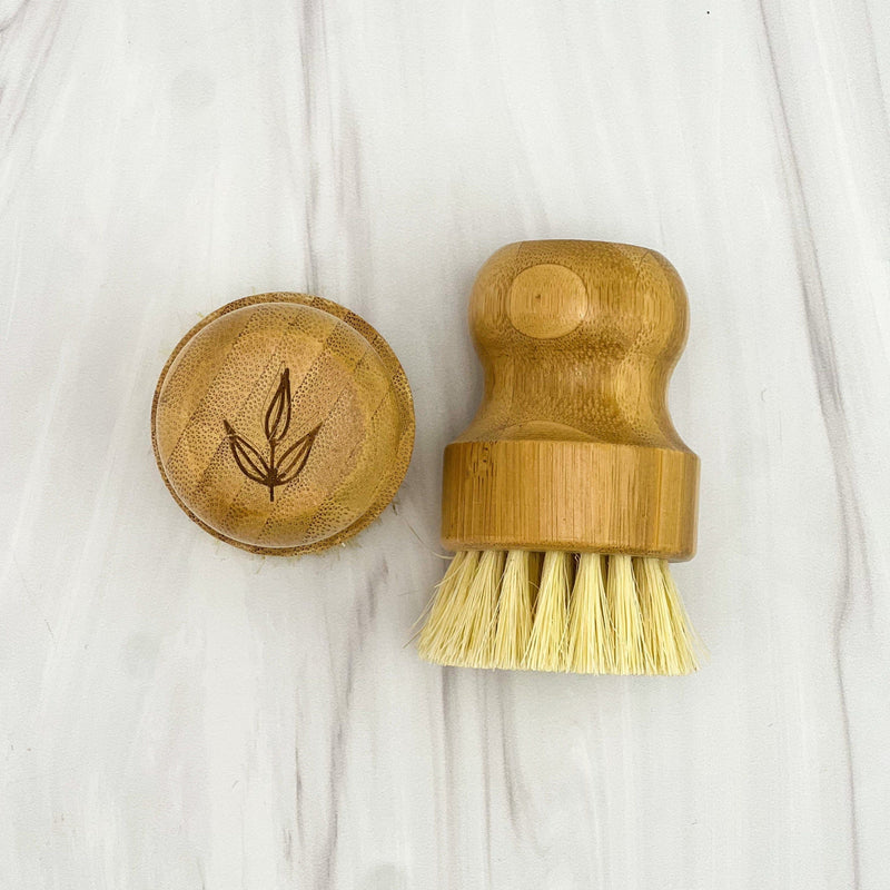 Sustainable bamboo pot brush with natural sisal bristles and engraved logo.