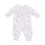 Long sleeve baby romper in Enchanted Woodland print with smocking across the chest and snap closures