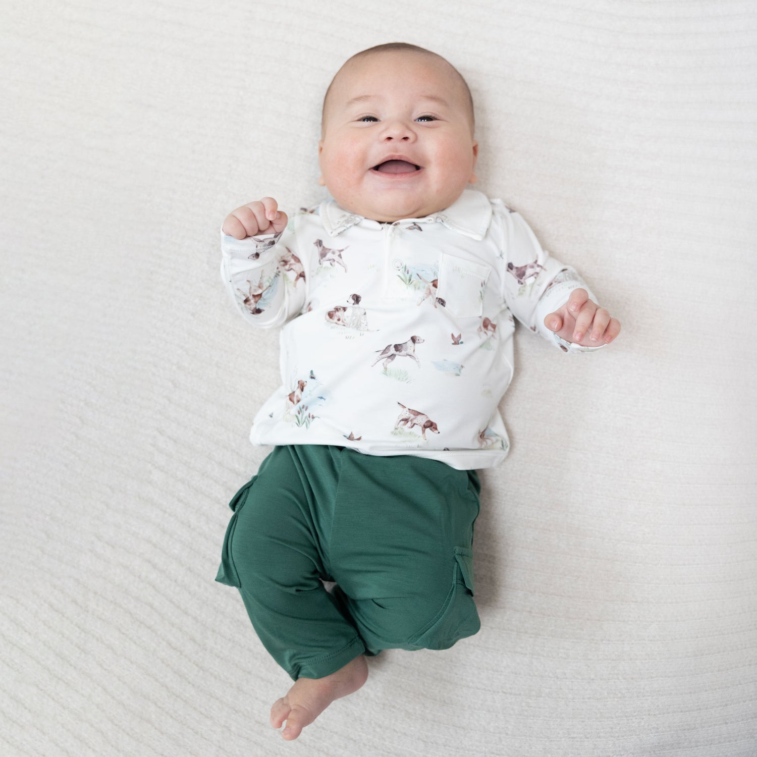 Two-piece baby set with a polo in a pointer dog and duck print paired with matching cargo pants.