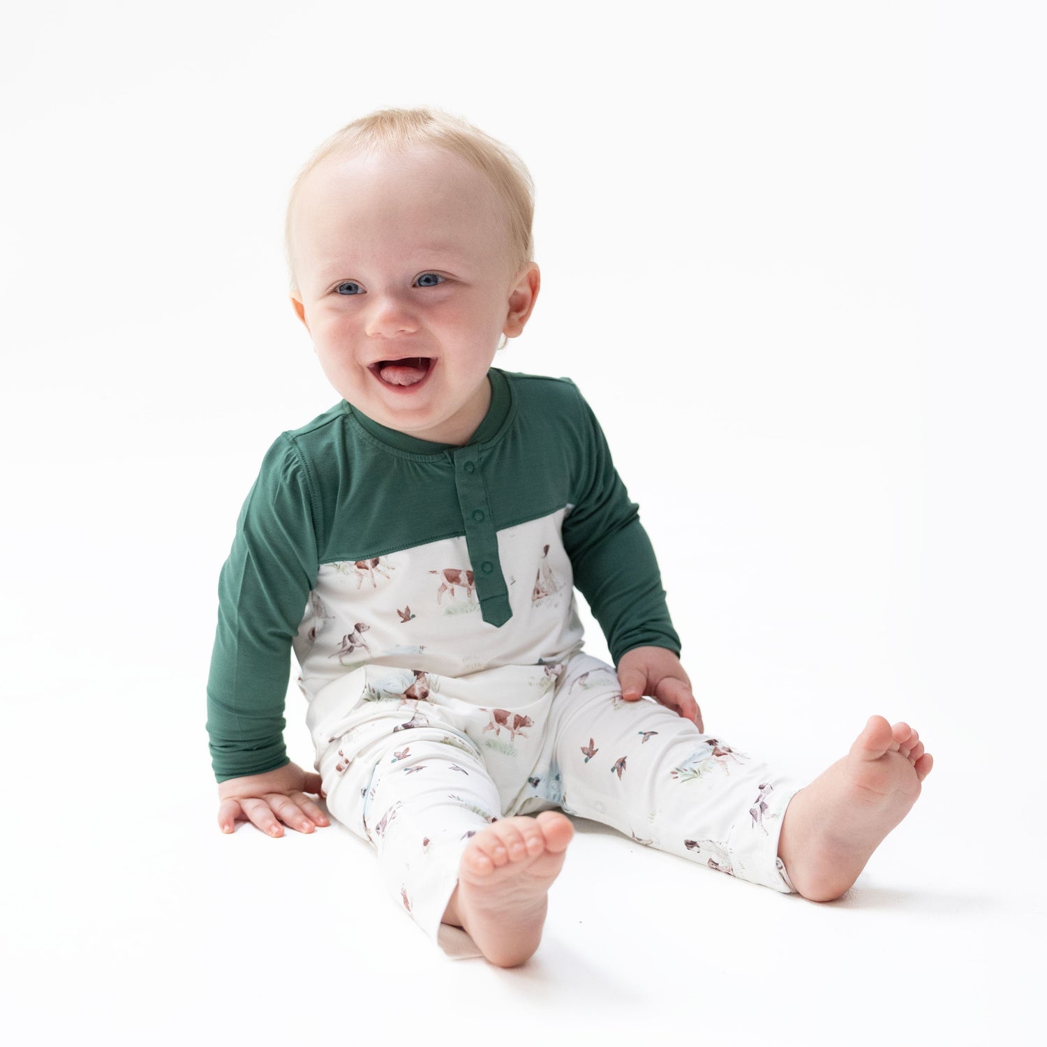 Long-sleeve baby romper with pointer pup and duck print and contrasting sleeve color, snap closure