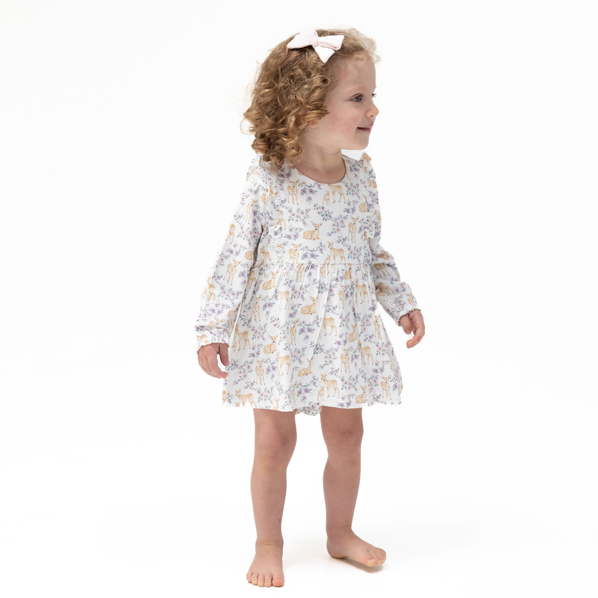 Long sleeve ruffle bodysuit dress in a floral deer print with ruffle trim and built-in snap closure