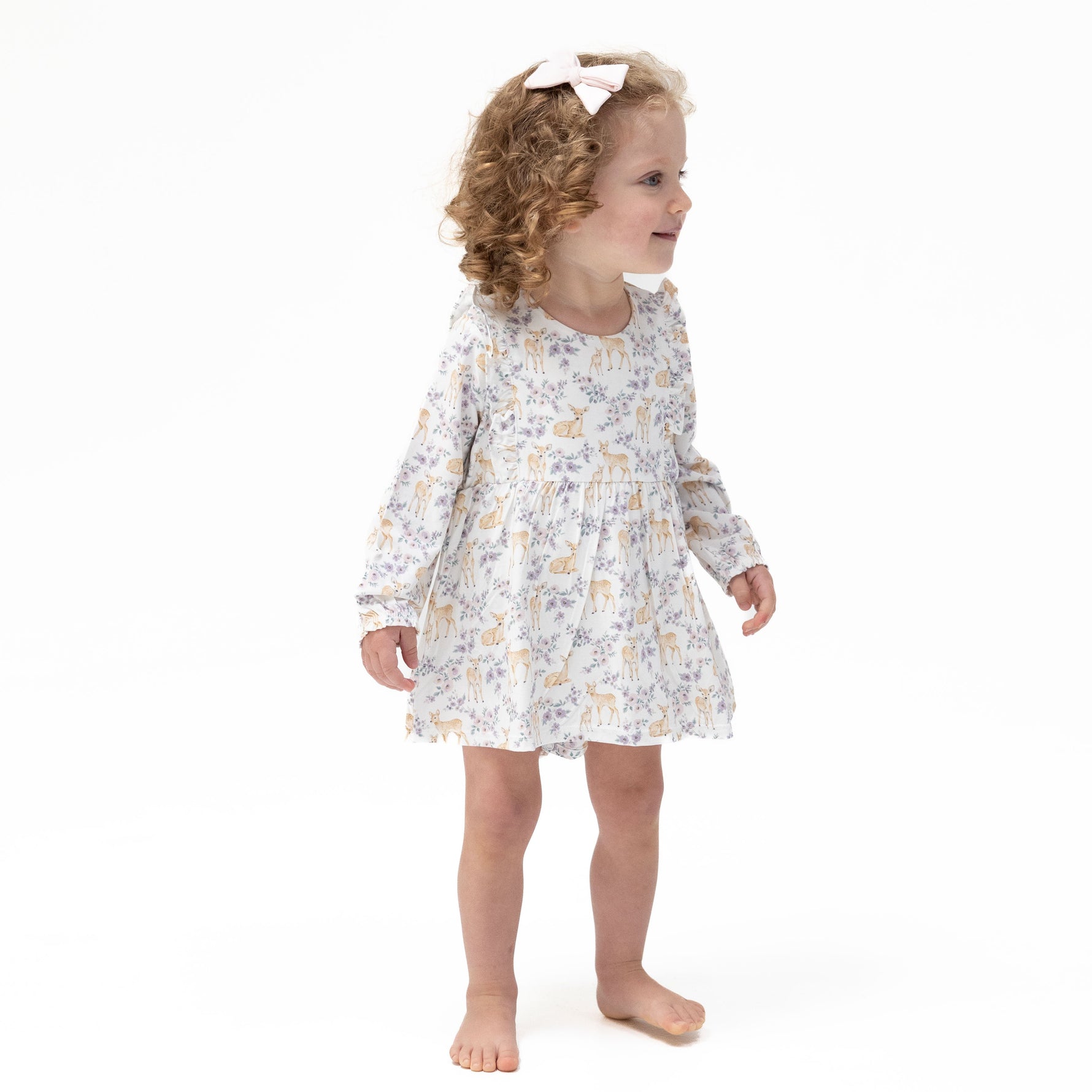 Long sleeve ruffle bodysuit dress in a floral deer print with ruffle trim and built-in snap closure