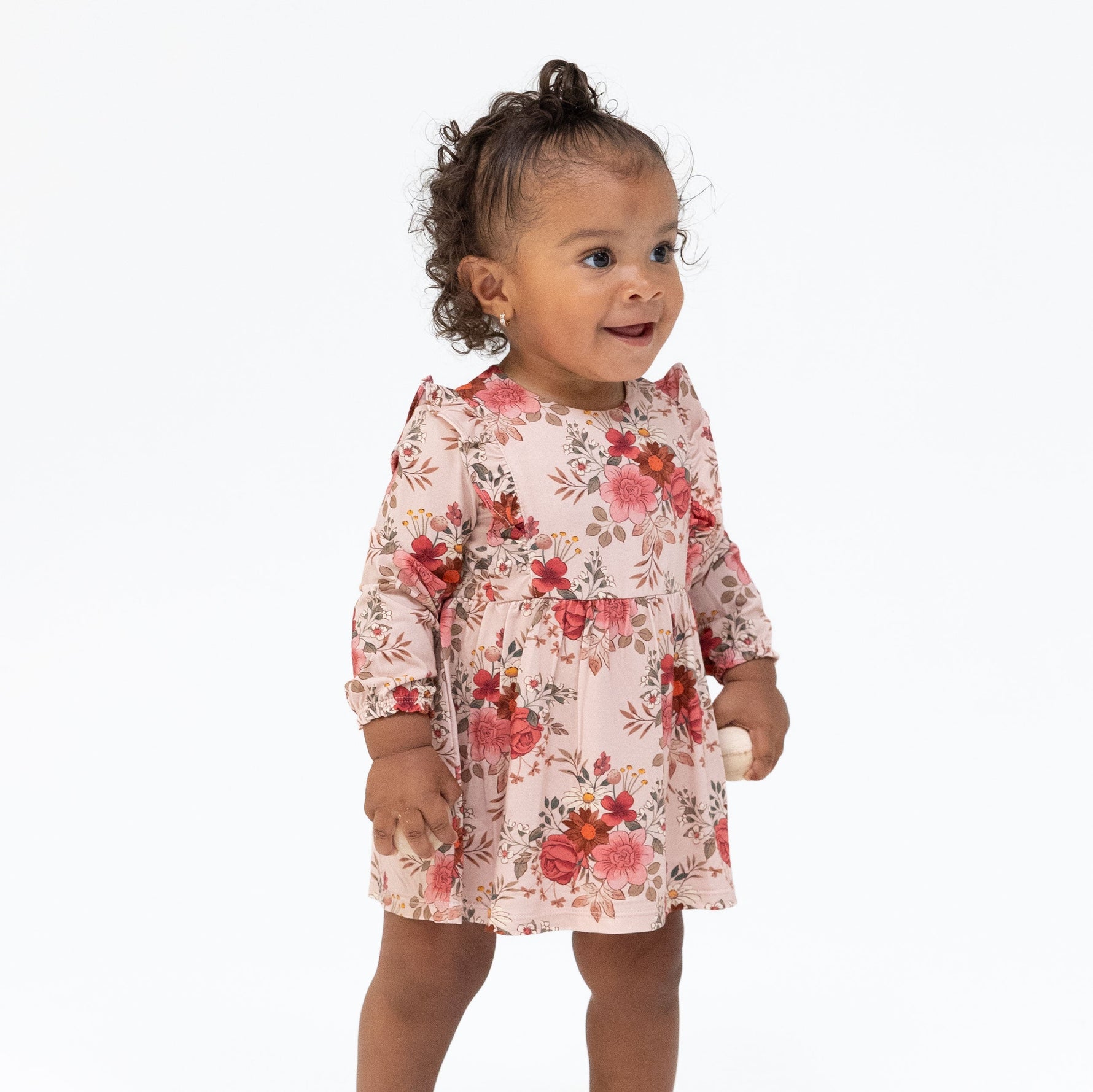 Long sleeve ruffle bodysuit dress in Sabrina floral print with scattered blooms and snap bottom