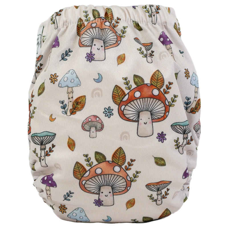 Tiny Tushies Newborn AIO Cloth Diaper with mushroom print.