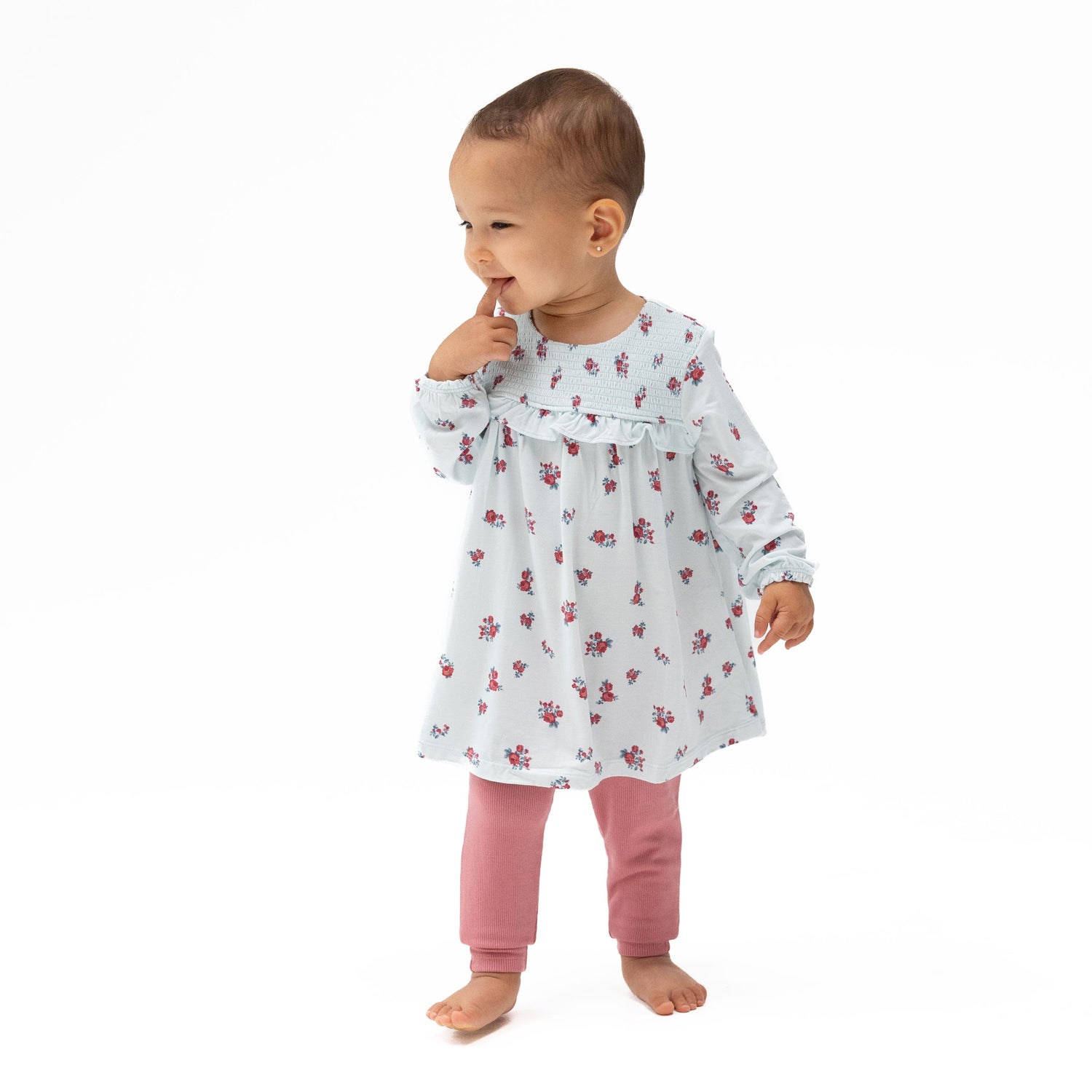 Floral long sleeve dress with smocked bodice and ruffle trim, paired with matching ribbed leggings.