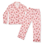 Adult long sleeve coat-style pajama top and pants in a Bows and Santa print with contrast piping