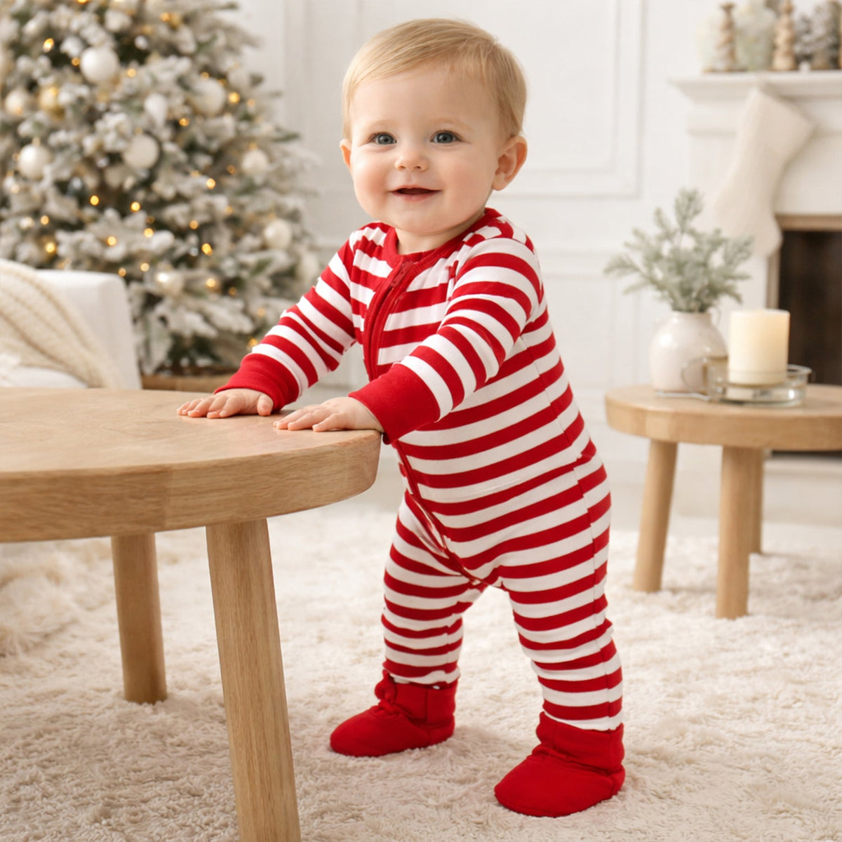 Baby zipper romper in red and white candy cane stripes with red trim and front zipper