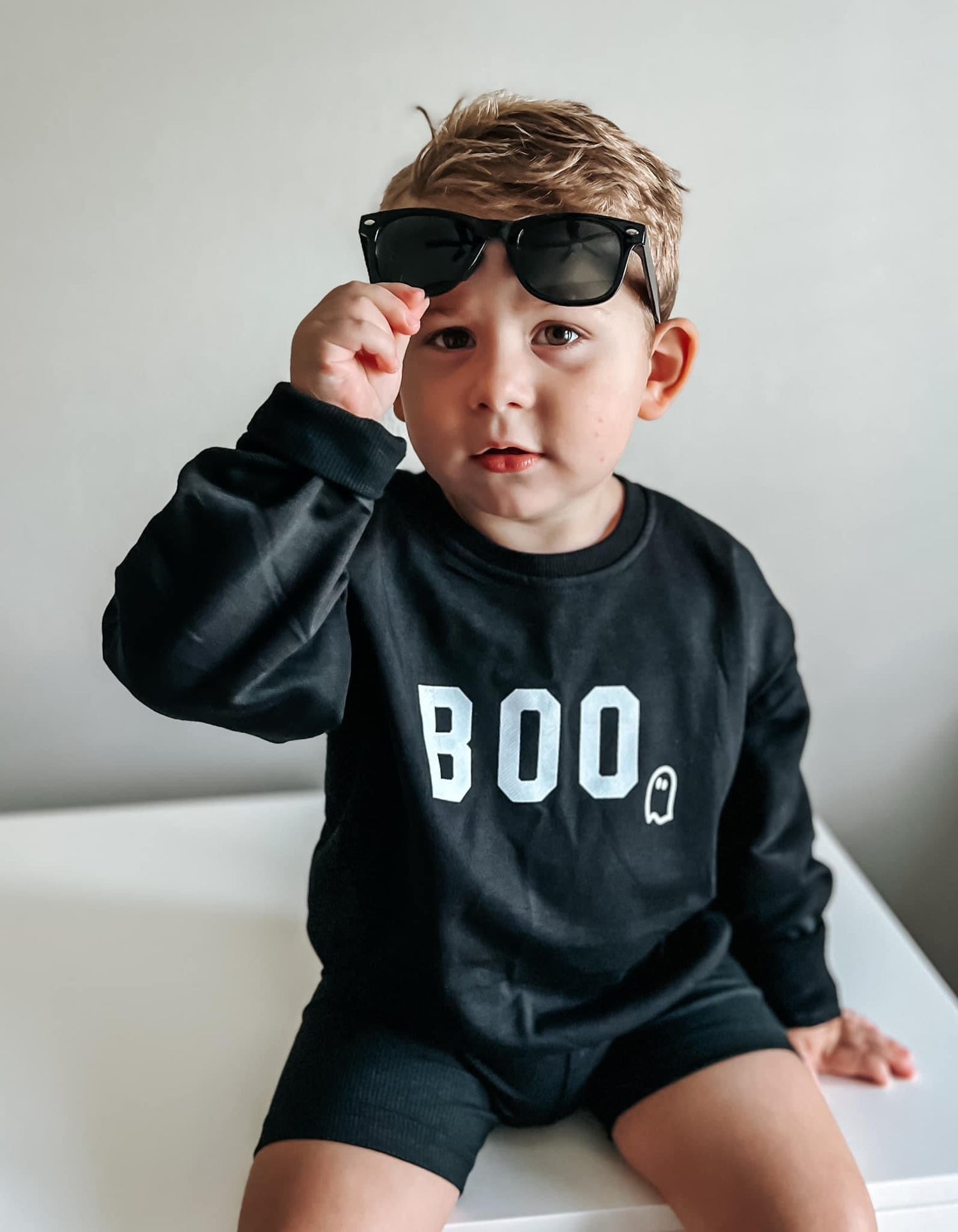Oversized crewneck sweatshirt with a BOO ghost graphic across the front