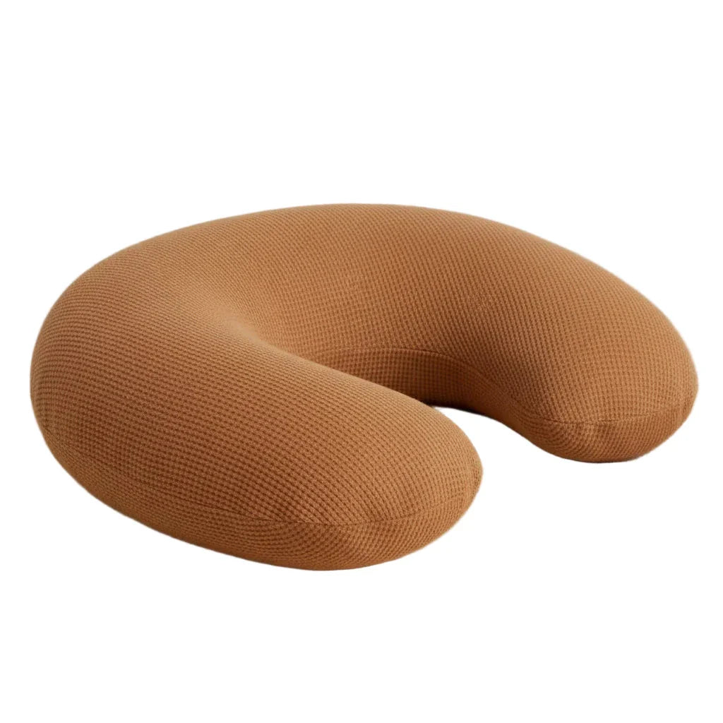 Close-up of a Caramel Waffle Nursing Pillow Cover by Little Mae & Co, showcasing its soft, textured organic fabric.