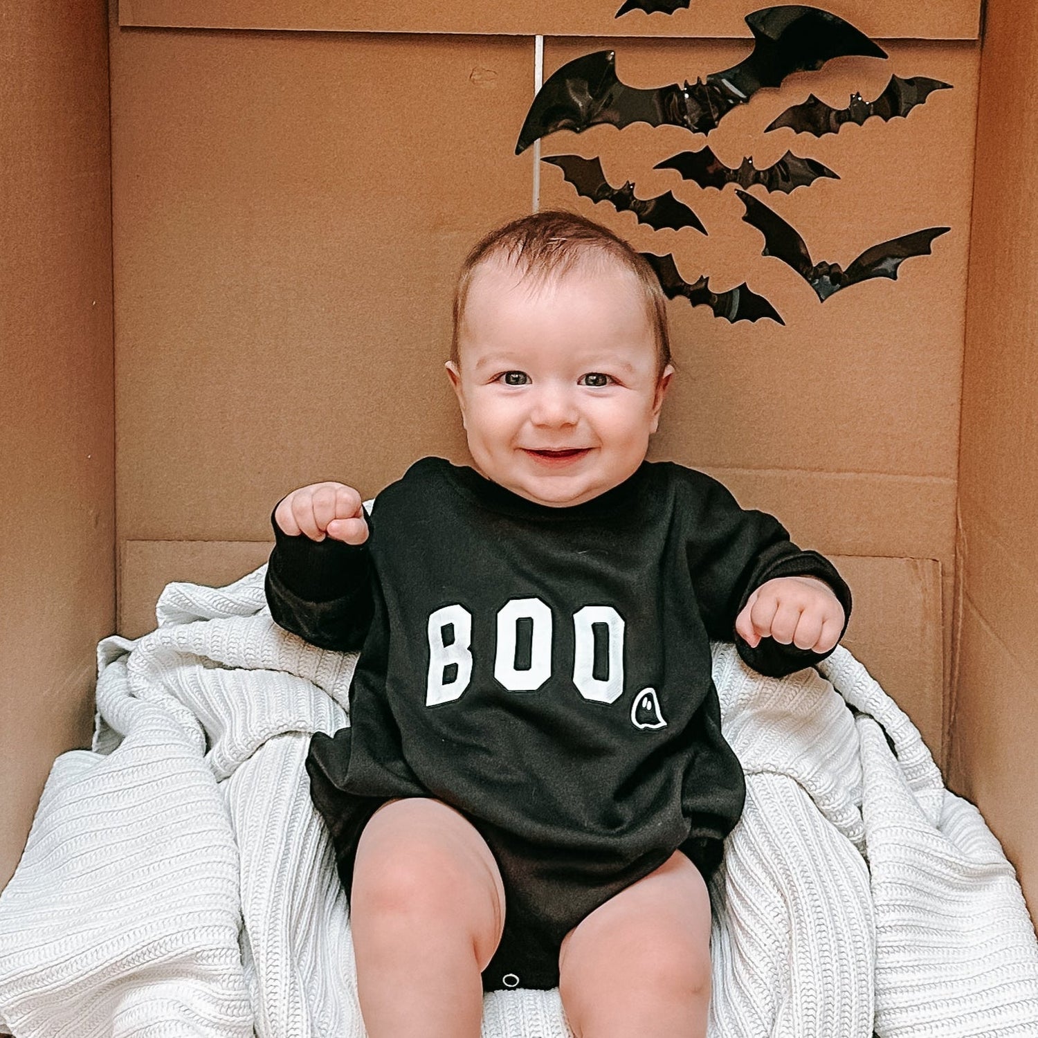 Oversized sweatshirt romper with BOO ghost graphic and snap closure at the crotch