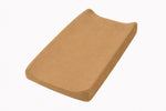 Solid brown changing pad cover fitted over a contoured changing pad
