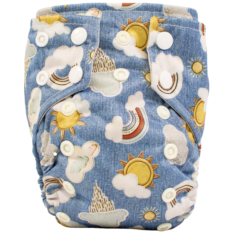 Tiny Tushies Newborn AIO Cloth Diaper with sun and cloud design, featuring adjustable snap closures.