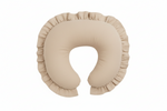 Beige nursing pillow cover with a ruffle trim edge, shaped to fit a standard curved feeding pillow.