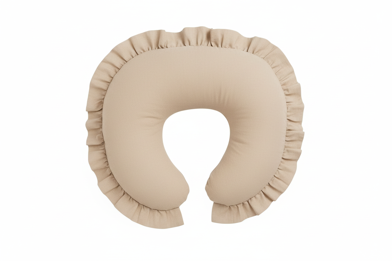 Beige nursing pillow cover with a ruffle trim edge, shaped to fit a standard curved feeding pillow.