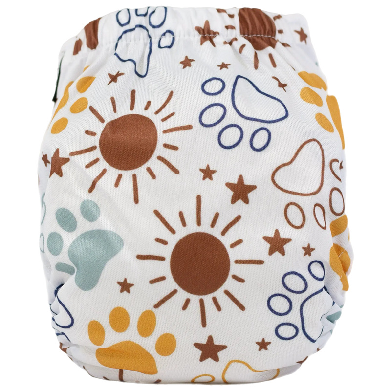 Tiny Tushies Newborn AIO Cloth Diaper with sun and paw print design.