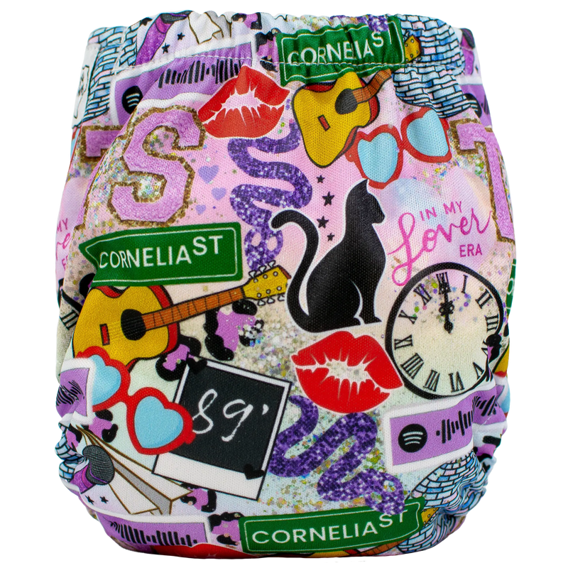 Tiny Tushies Newborn AIO Cloth Diaper with colorful, playful cat and guitar print.